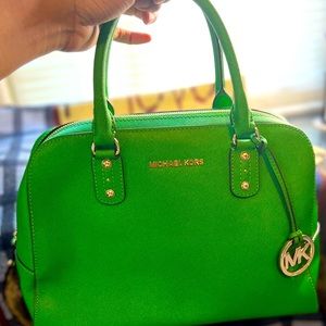 Green Michael Kors bag with gold accents